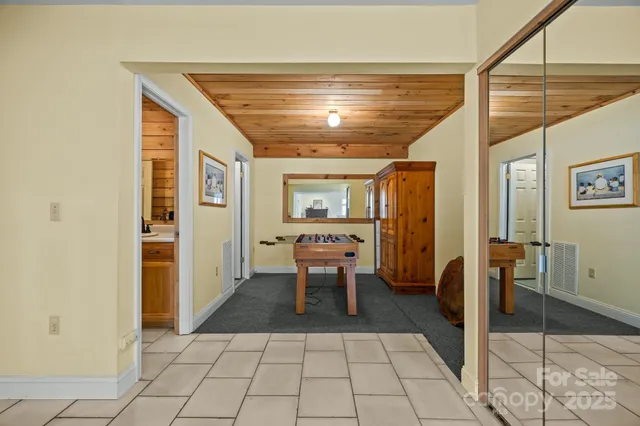 a backyard of a house with wooden deck and seating space