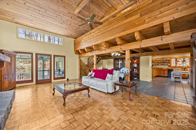 a room with lots of furniture and a chandelier