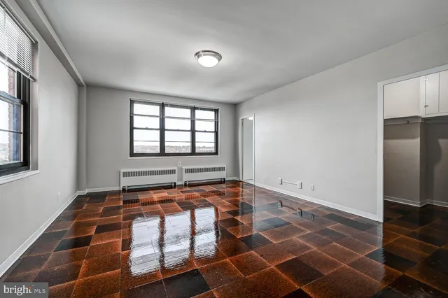 a view of a room with windows and chandelier