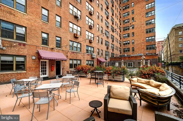 a view of a building with outdoor seating