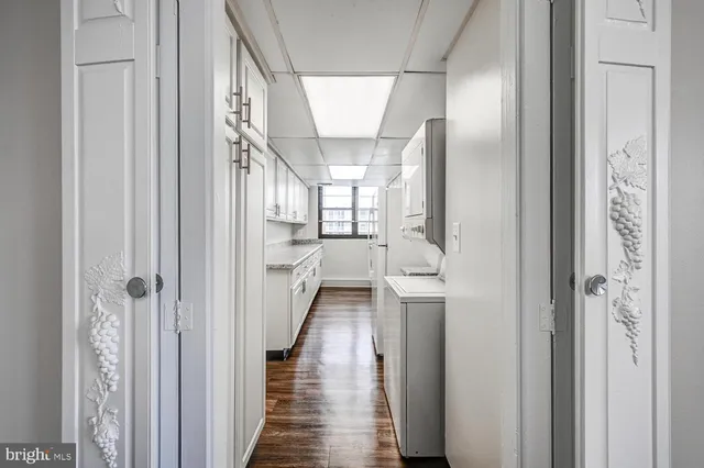 a view of entryway and hall with wooden floor