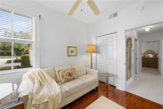 a spacious bedroom with a bed and a large window