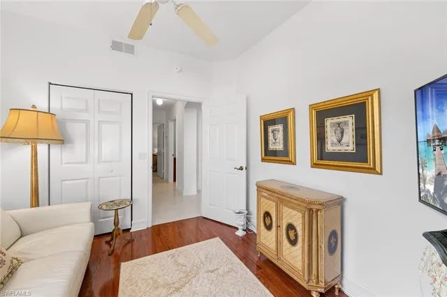 a view of a livingroom with furniture and a ceiling fan