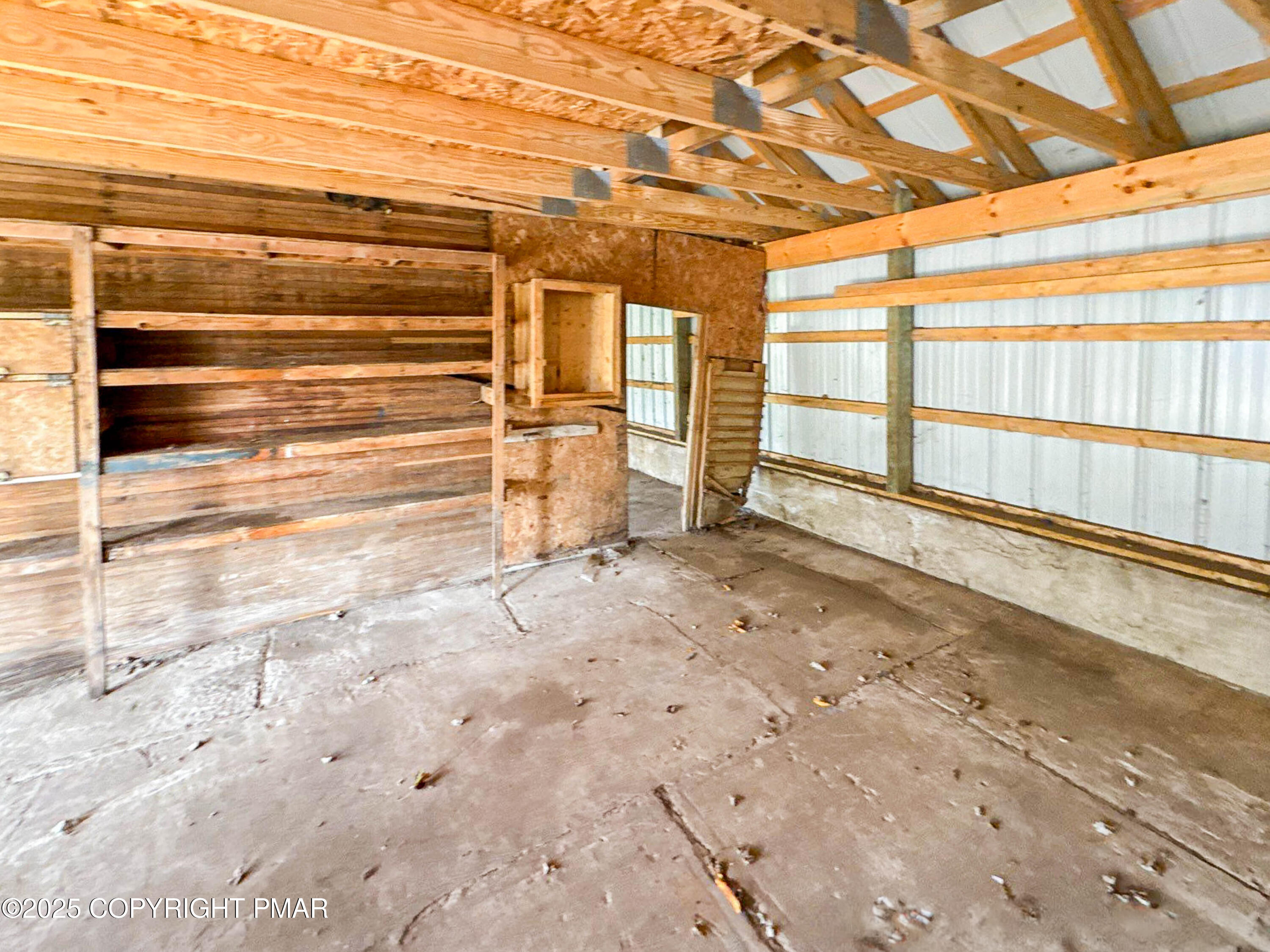 1162 Cemetery Road Muncy, PA 17756 - Photo 32 of 36 a view of an empty room with wooden floor and a window