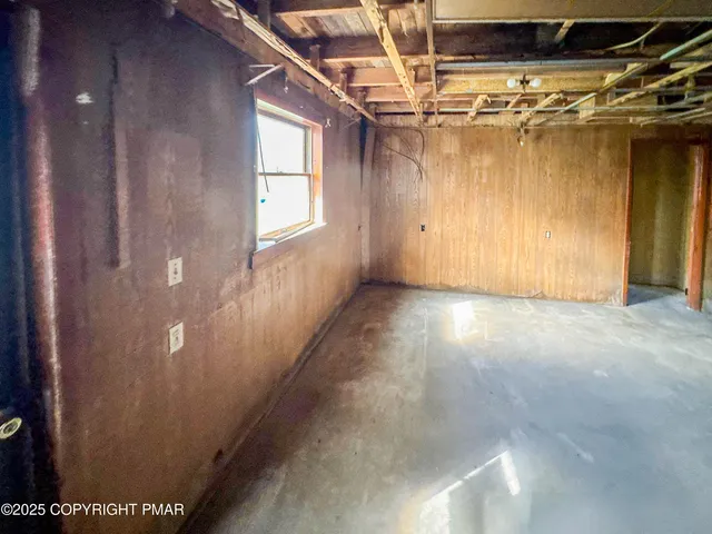 a view of a room with wooden walls