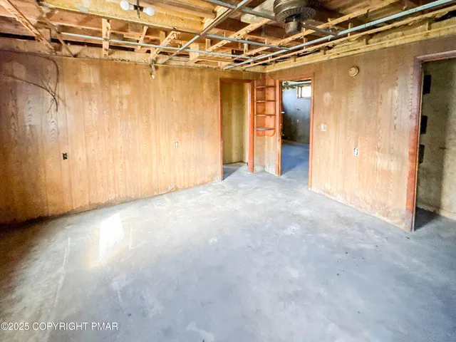 a view of a room with wooden walls