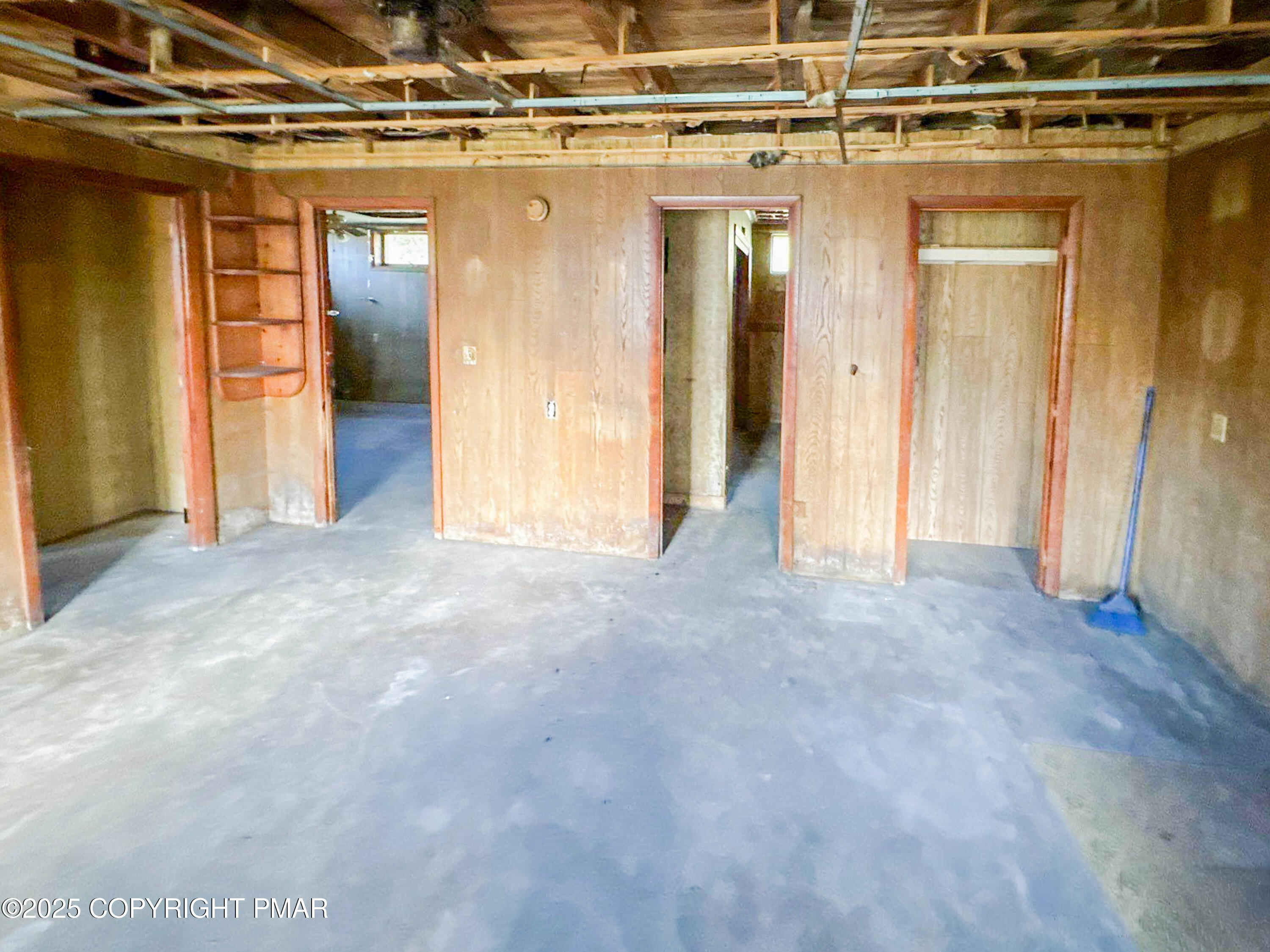 1162 Cemetery Road Muncy, PA 17756 - Photo 6 of 36 a view of a hallway with wooden walls