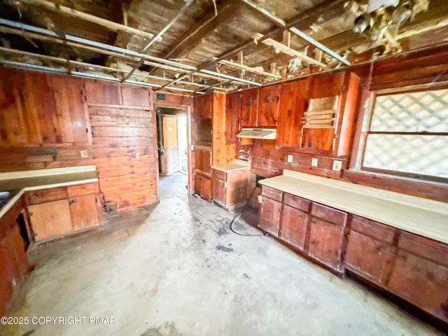 a large kitchen with a large window