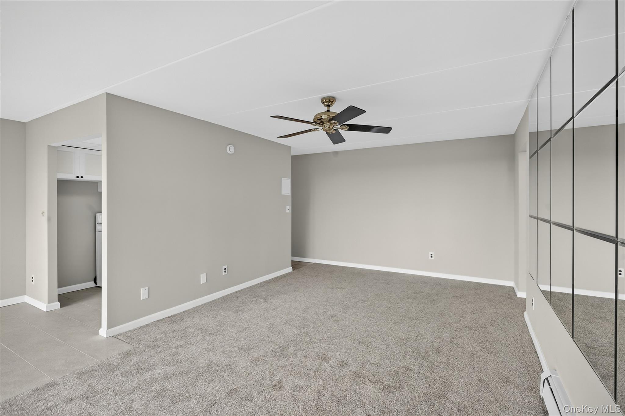 150 Overlook Avenue, Unit 7F Peekskill, NY 10566 - Photo 12 of 24 a view of an empty room with a ceiling fan