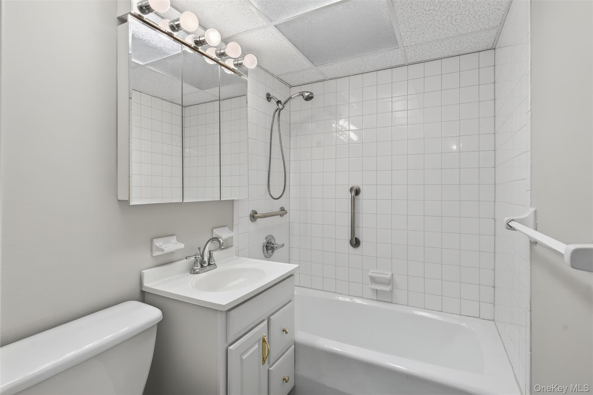 150 Overlook Avenue, Unit 7F Peekskill, NY 10566 - Photo 13 of 24 a bathroom with a sink a toilet and shower