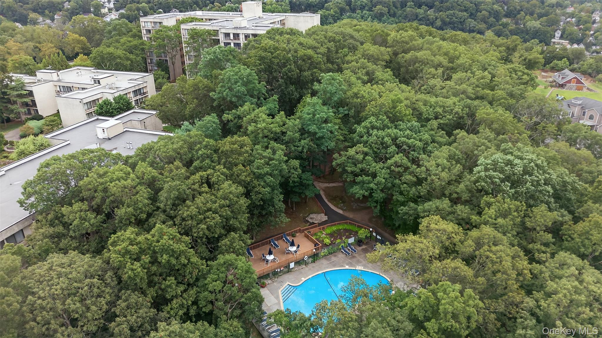 150 Overlook Avenue, Unit 7F Peekskill, NY 10566 - Photo 22 of 24 an aerial view of a house with a yard and outdoor seating