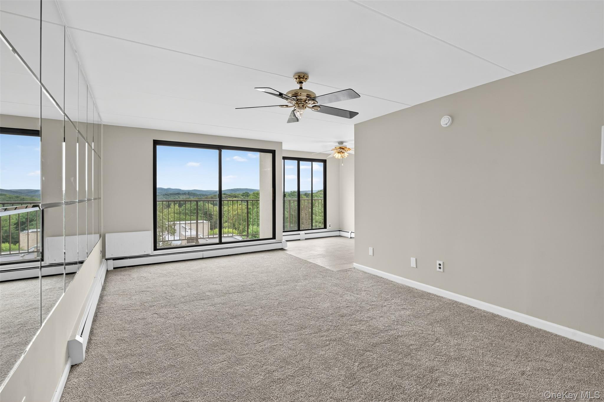 150 Overlook Avenue, Unit 7F Peekskill, NY 10566 - Photo 3 of 24 a view of a livingroom with a ceiling fan and window
