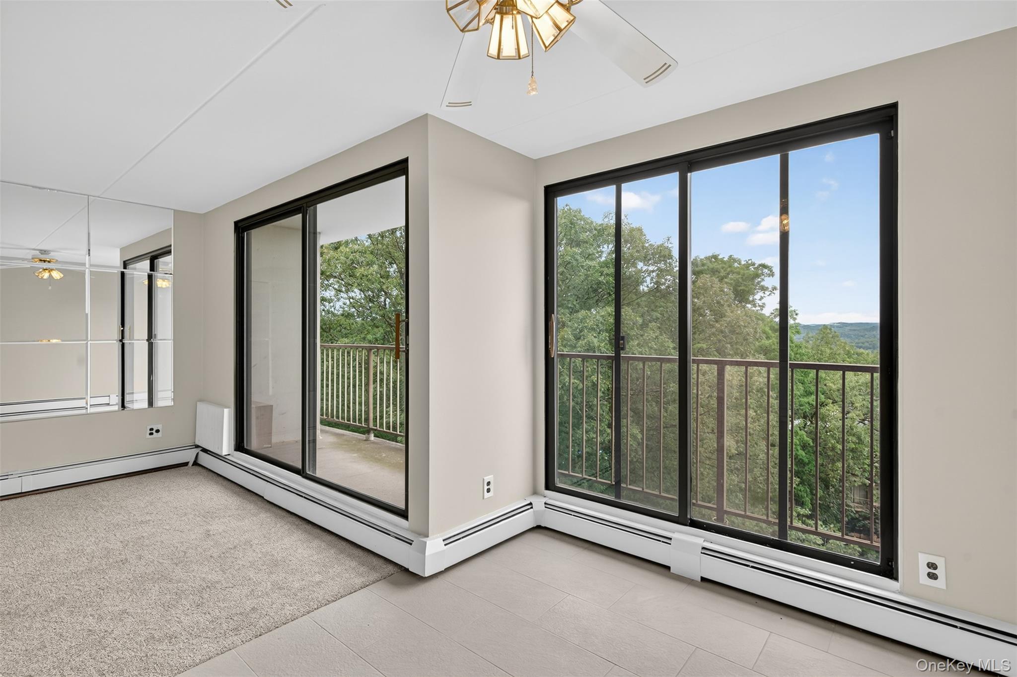 150 Overlook Avenue, Unit 7F Peekskill, NY 10566 - Photo 6 of 24 a view of a room with sliding glass door and mountain view