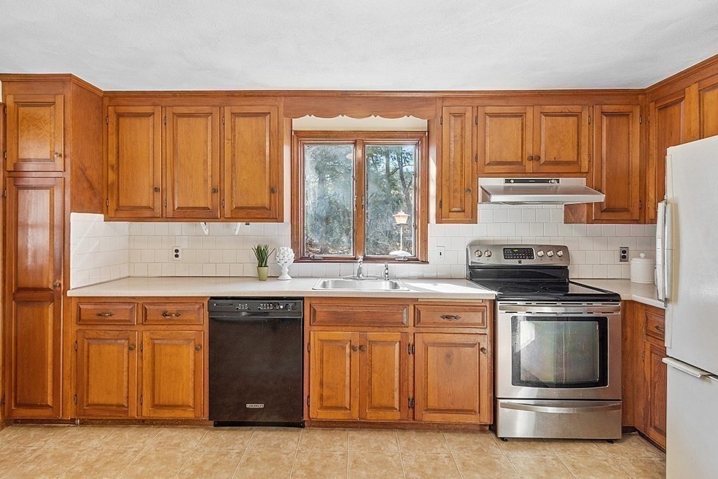 31 Ward Road Sudbury, MA 01776 - Photo 11 of 26 a kitchen with a stove and a sink