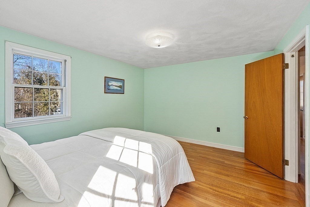 31 Ward Road Sudbury, MA 01776 - Photo 17 of 26 a bedroom with a bed and a window