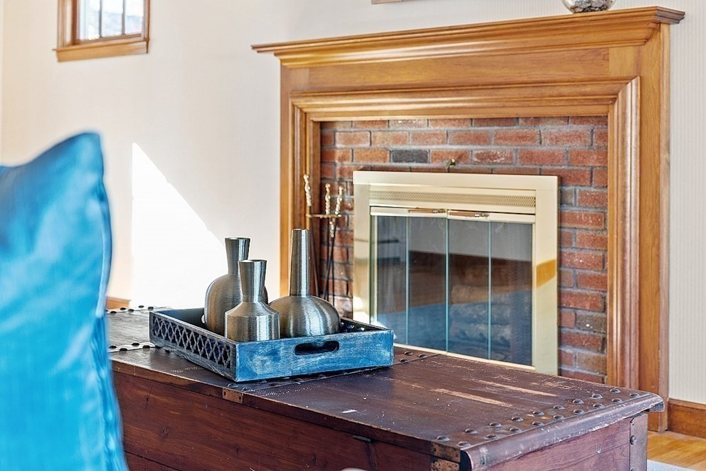 31 Ward Road Sudbury, MA 01776 - Photo 9 of 26 a living room with furniture and a fireplace