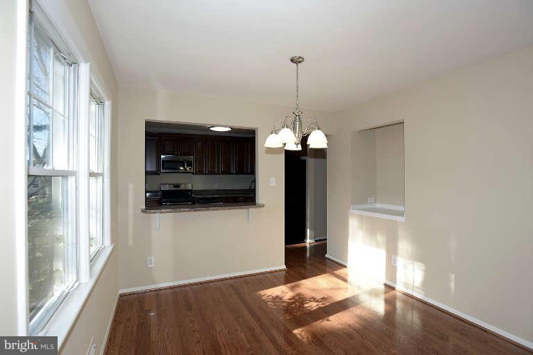 3816 Littleton Street Silver Spring, MD 20906 - Photo 6 of 21 a view of a hallway with a chandelier