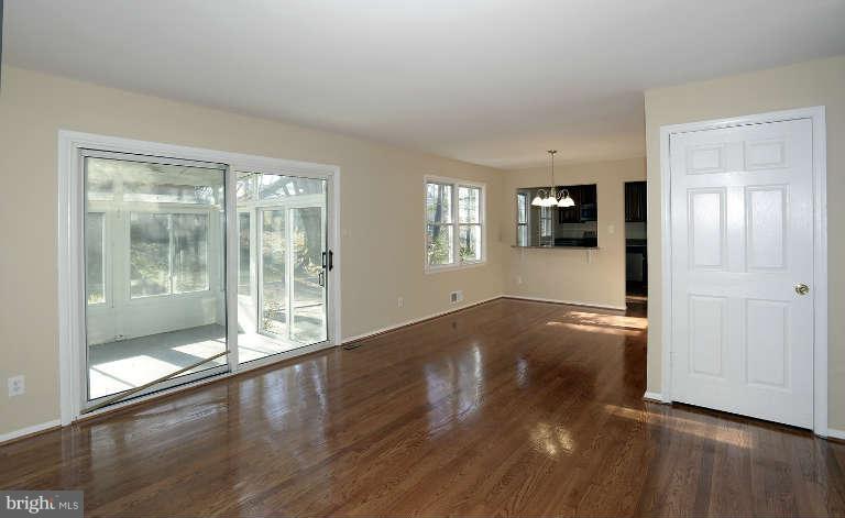 3816 Littleton Street Silver Spring, MD 20906 - Photo 8 of 21 a view of empty room with wooden floor and fan