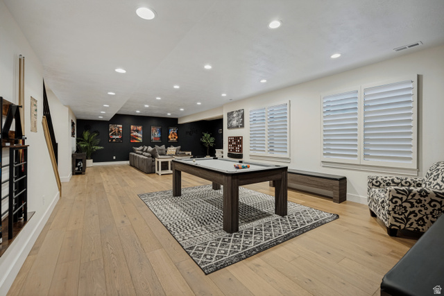 13257 Sky Rnch Road Herriman, UT 84096 - Photo 14 of 17 Recessed lighting, wood-finish flooring, and two windows with white louvered shutters