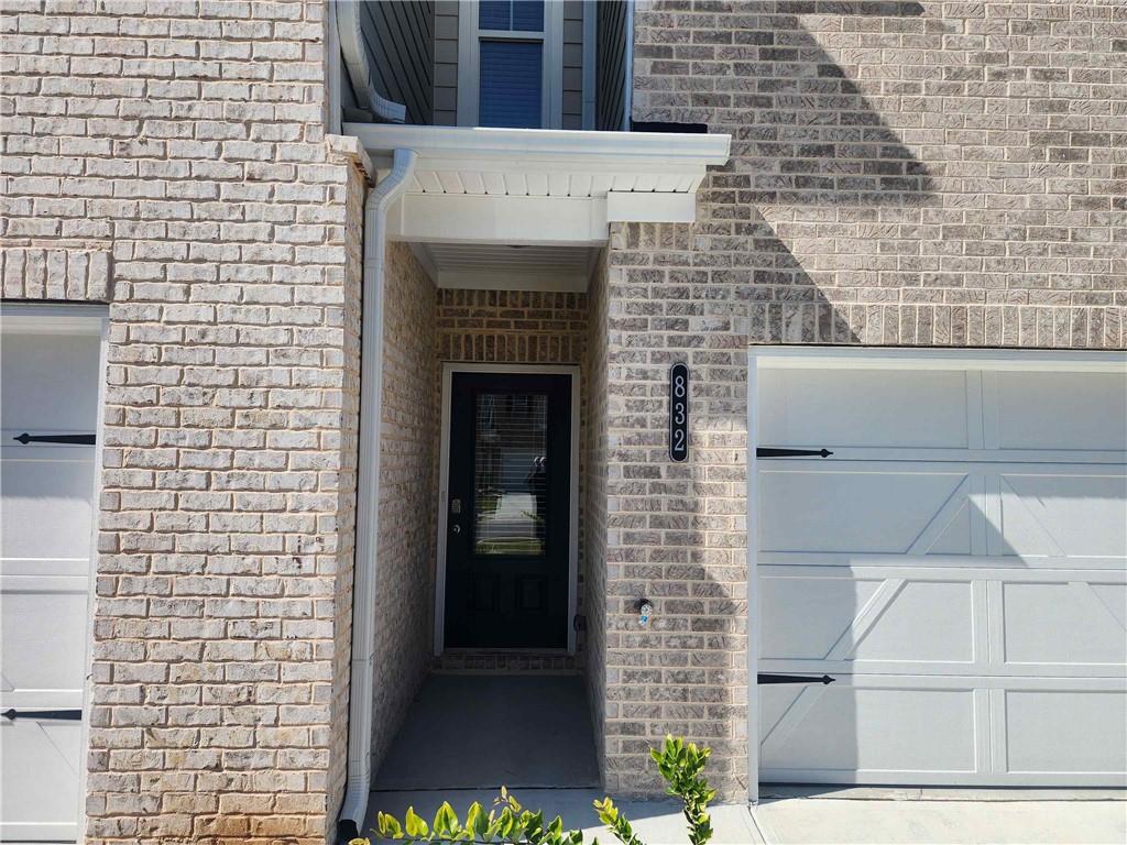 832 Cygnet Lane Grayson, GA 30017 - Photo 3 of 35 a building with a door