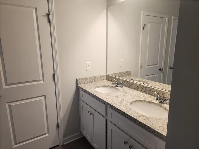 a view of a swimming pool with lawn chairs under an umbrella