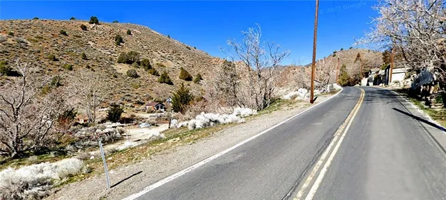 a view of a snow on the road
