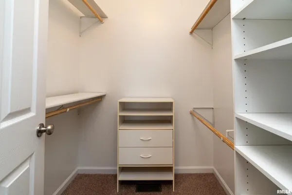 a view of an empty walk in closet