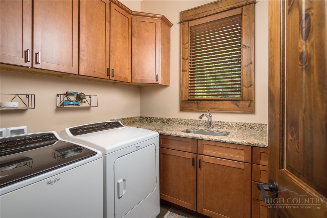 115 Passionflower Trail Boone, NC 28607 - Photo 16 of 50 a kitchen with a sink stove and cabinets