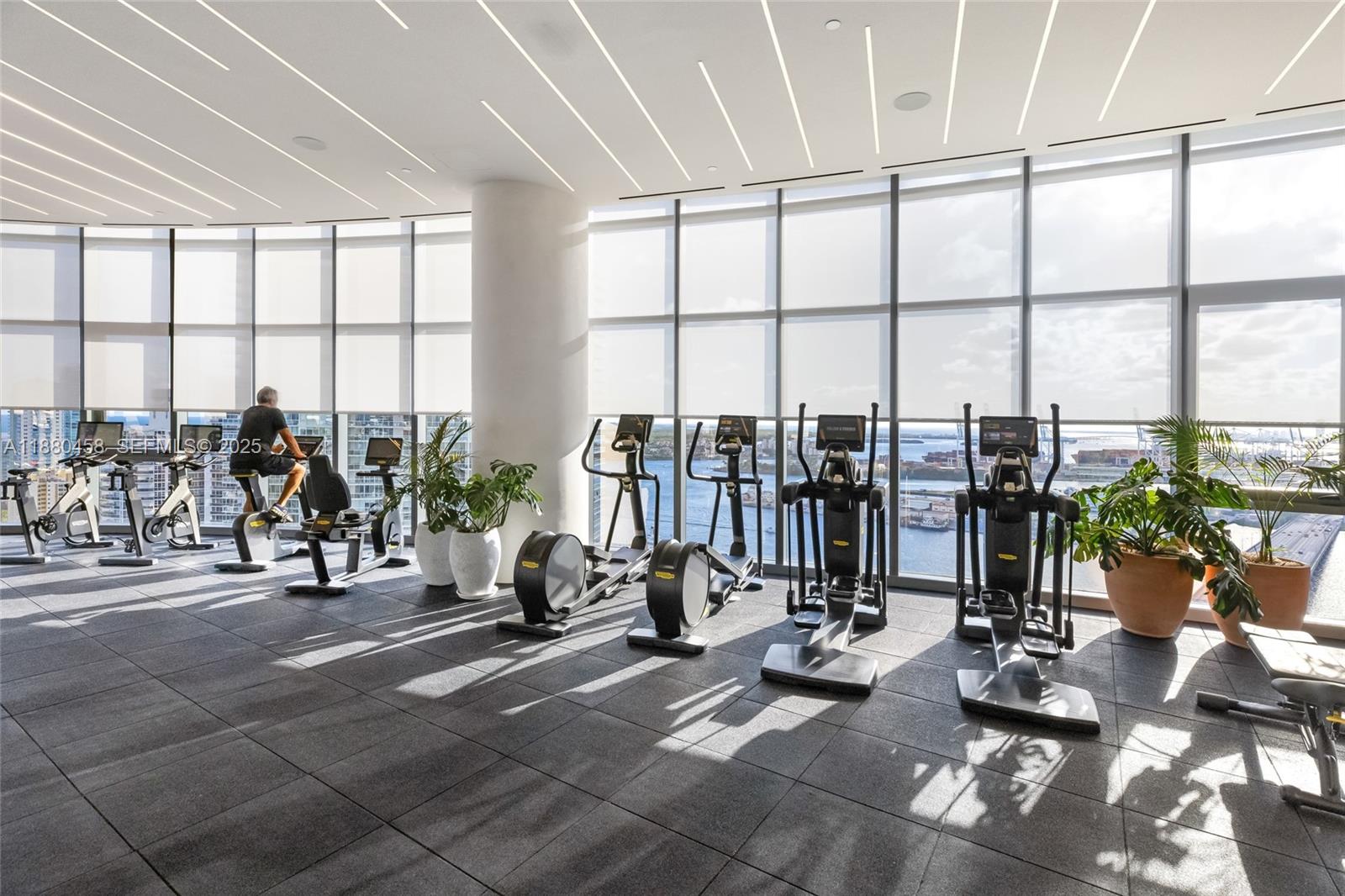500 Alton Road, Unit 2802 Miami Beach, FL 33139 - Photo 23 of 51 a view of a room with gym equipment