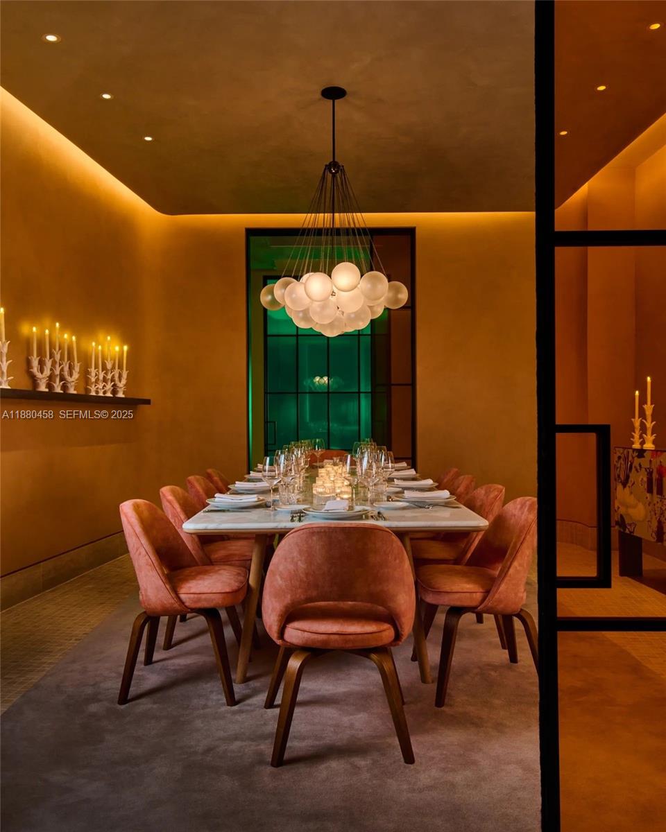 500 Alton Road, Unit 2802 Miami Beach, FL 33139 - Photo 26 of 51 a view of a dining room with furniture and chandelier