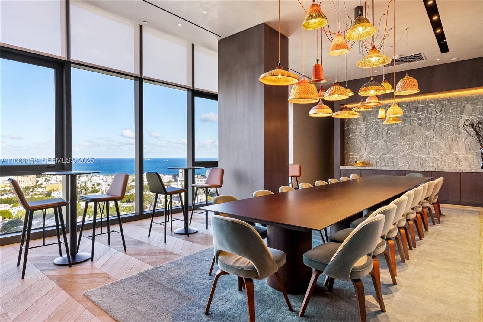 500 Alton Road, Unit 2802 Miami Beach, FL 33139 - Photo 27 of 51 a view of a dining room with furniture and wooden floor