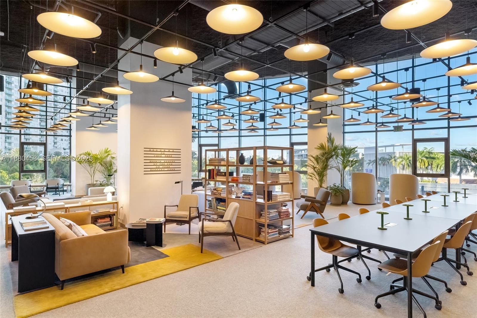 500 Alton Road, Unit 2802 Miami Beach, FL 33139 - Photo 29 of 51 a living room with furniture a chandelier and a large window