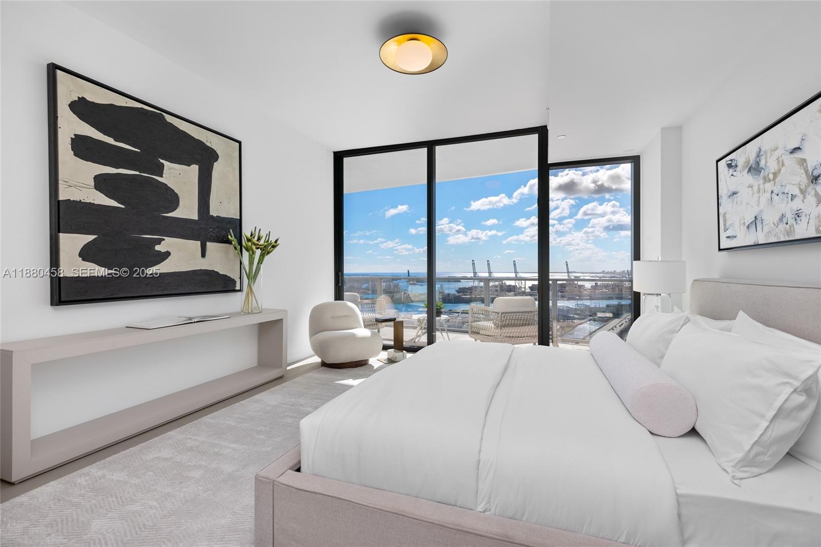 500 Alton Road, Unit 2802 Miami Beach, FL 33139 - Photo 36 of 51 a bedroom with a bed and a painting on the wall