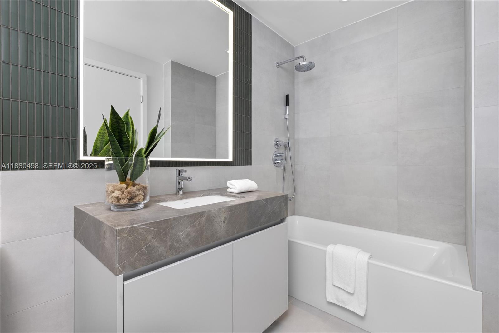 500 Alton Road, Unit 2802 Miami Beach, FL 33139 - Photo 37 of 51 a bathroom with a sink and a mirror