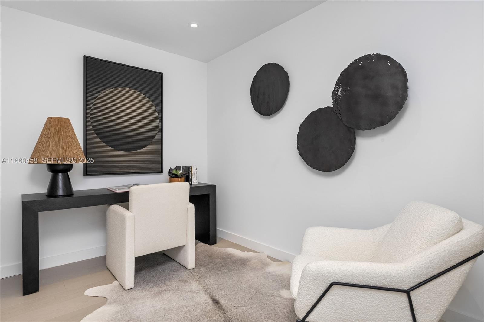 500 Alton Road, Unit 2802 Miami Beach, FL 33139 - Photo 40 of 51 a living room with couches and a mirror