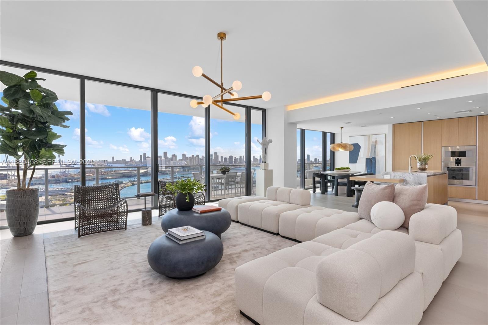 500 Alton Road, Unit 2802 Miami Beach, FL 33139 - Photo 4 of 51 a living room with furniture and a large window