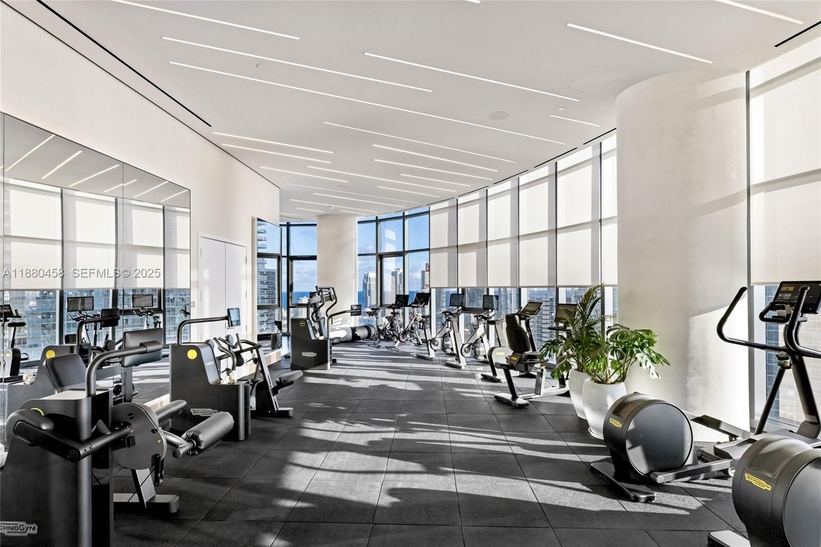 500 Alton Road, Unit 2802 Miami Beach, FL 33139 - Photo 44 of 51 a view of a room with gym equipment