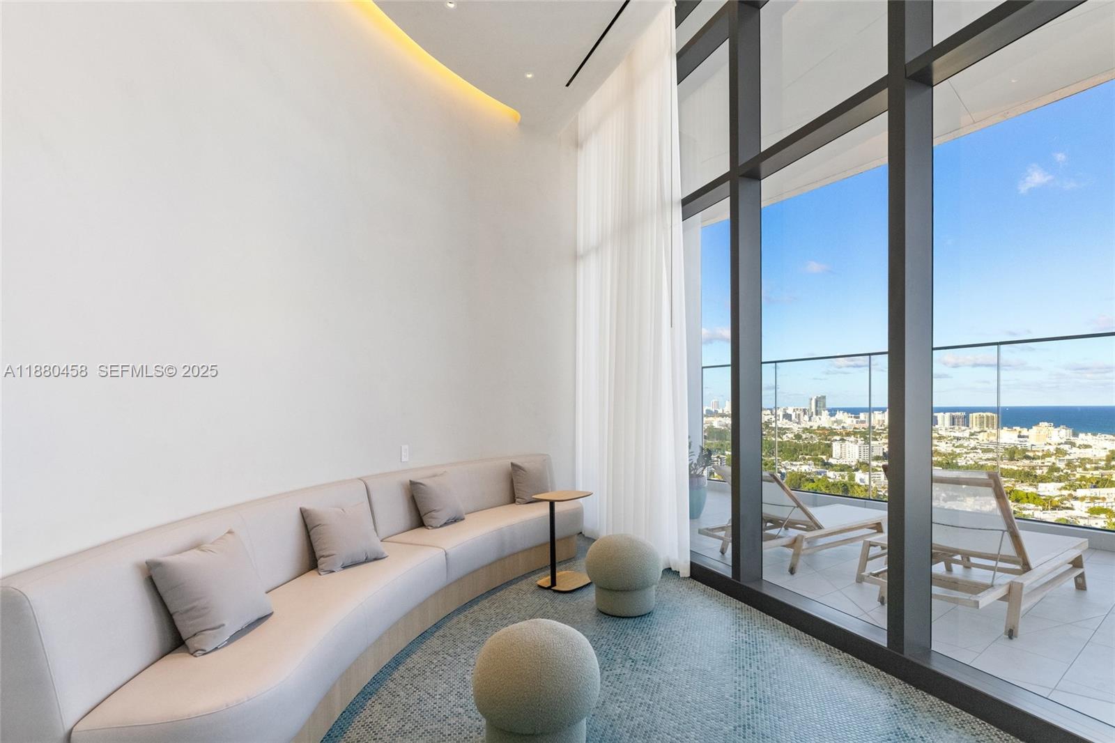 500 Alton Road, Unit 2802 Miami Beach, FL 33139 - Photo 46 of 51 a living room with furniture and a floor to ceiling window