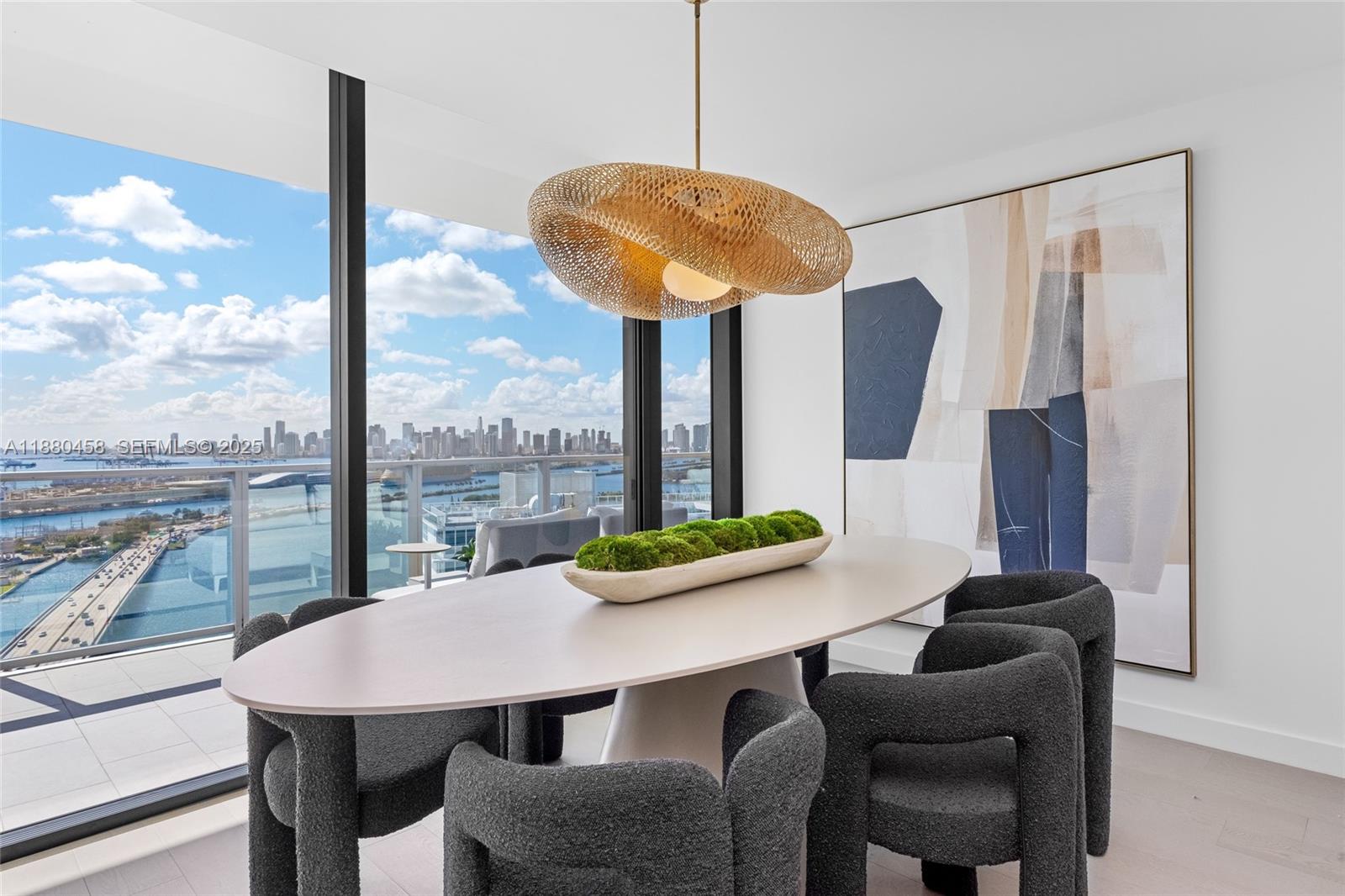 500 Alton Road, Unit 2802 Miami Beach, FL 33139 - Photo 9 of 51 a view of a dining room with furniture window and outside view