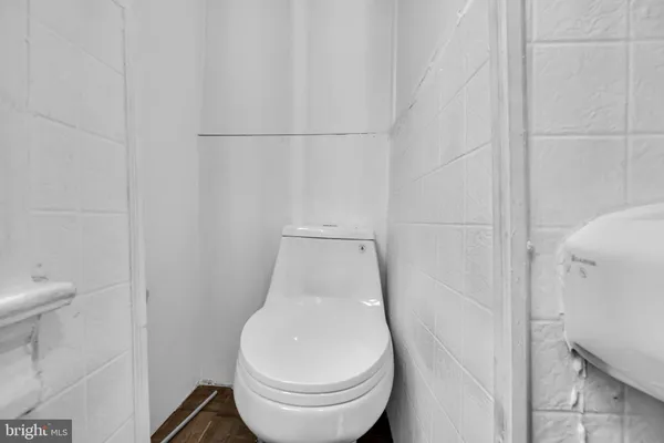 a white toilet sitting next to a white sink