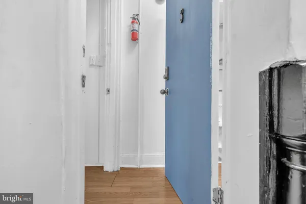 a view of an entryway with wooden floor