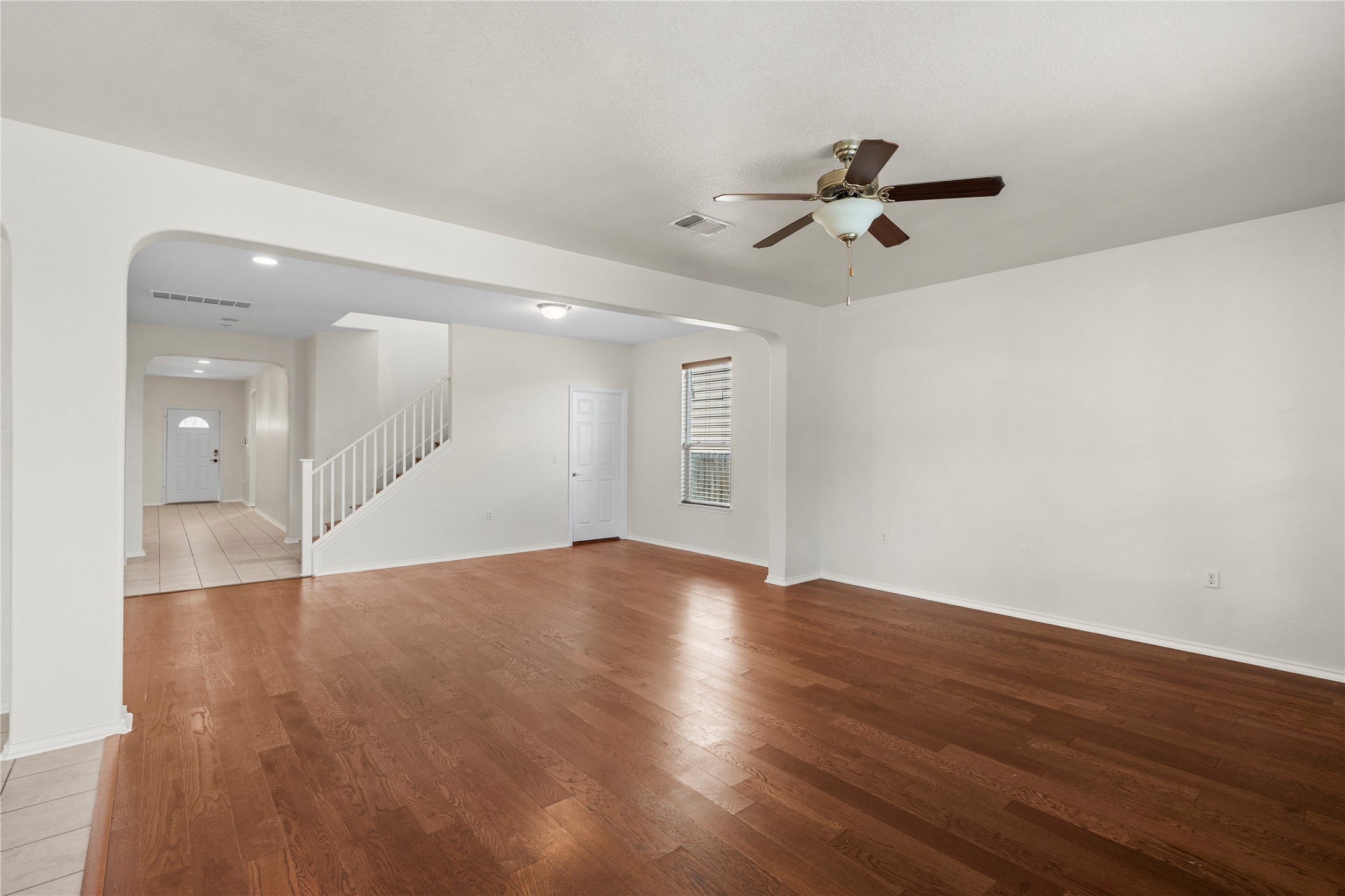 8613 Capitol View Drive Austin, TX 78747 - Photo 18 of 33 Rich hardwood flooring creates a welcoming ambiance throughout this generously proportioned living space.