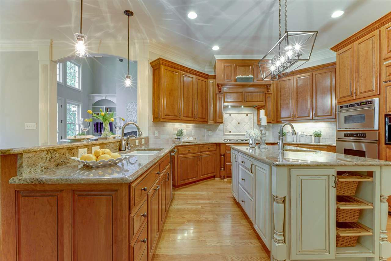 1317 Caistor Lane Raleigh, NC 27614 - Photo 3 of 24 State of the art kitchen -a chef's dream! Gorgeous cabinetry and beautiful GRANITE counters with a huge island with counter seating. Kitchen