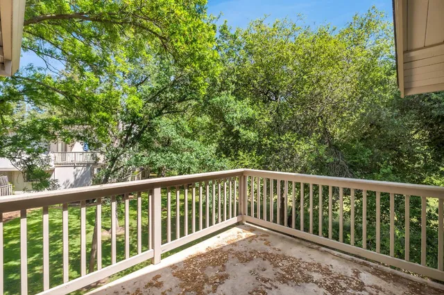 a porch with a yard in back