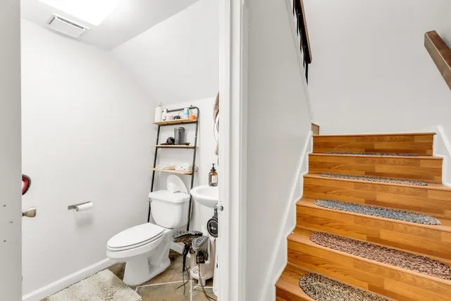 a bathroom with a toilet and a shower
