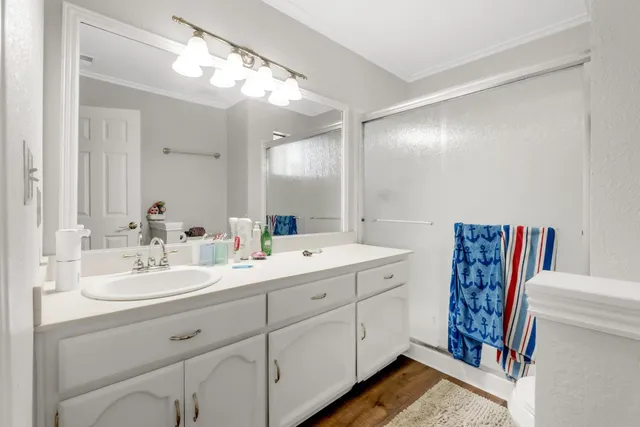 a bathroom with a double vanity sink and a mirror