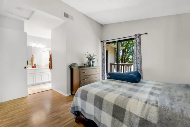 a bathroom with a sink vanity and a mirror