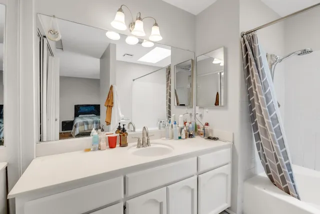 a bathroom with a sink a toilet and a bathtub