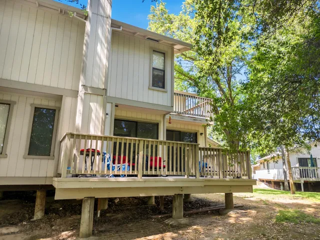 an aerial view of a house with a yard and garden