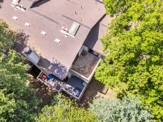 an aerial view of a house with a yard